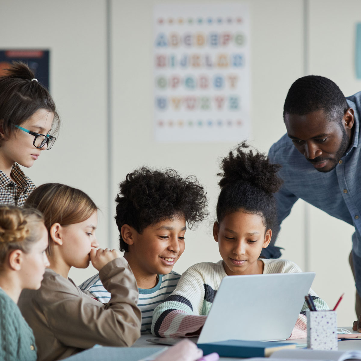 children and teacher in a classroom